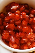 Pomegranate seeds in small bowl