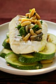 Coley with courgettes, pine nuts and parsley