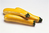 Three yellow courgettes