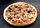 Pizza with ham, mushrooms and olives