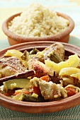 Chicken ragout with courgettes and lemons; couscous (Morocco)