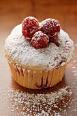 Raspberry muffin with icing sugar