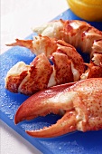 Lobster, cooked and prepared, with slices of lemon