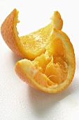 Squeezed wedge of orange and orange peel
