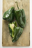 Green peppers (Poblano from Mexico) on chopping board