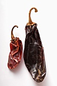 Two different dried chili peppers