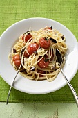 Spaghetti with cherry tomatoes, olives and Parmesan