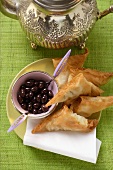 Savoury pasties and black olives from the Middle East