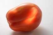 A tomato (lying on its side)
