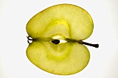 Slice of apple (sliced lengthwise), backlit