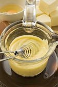 Hollandaise sauce in small glass pan