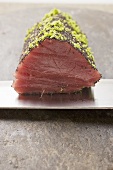 Raw tuna fillet with poppy seeds and lime zest