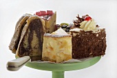 A selection of pieces of cake on cake stand