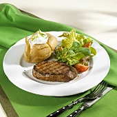 Beef steak with baked potato and salad