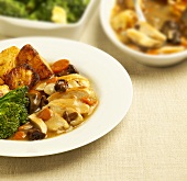Chicken breast in cep sauce with roast potatoes