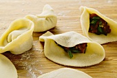 Making pasta parcels with loin of beef (China)