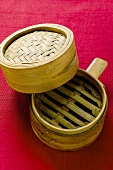 Bamboo steamer on red background