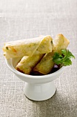 Spring rolls in small bowl