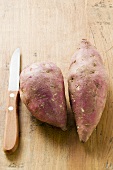 Two sweet potatoes and knife