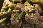 Lamb with artichokes, herbs and pine nuts