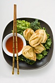 Deep-fried wontons with sweet and sour sauce