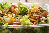 Salad leaves with vegetables, egg, cheese & bacon to take away