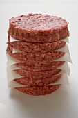 Raw burgers for hamburgers, in a pile