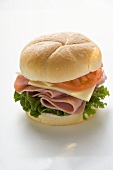 Ham, cheese and tomato in kaiser roll