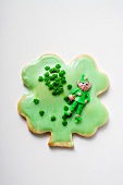 Shamrock biscuit with green icing for St. Patrick's Day