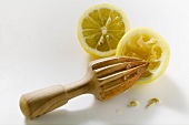 Lemon with lemon squeezer