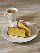 Two pieces of orange cake and cup of coffee