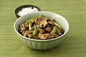 Beef with mushrooms and spring onions, rice