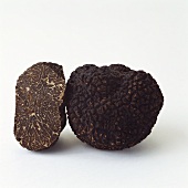 Whole and half black truffle from Perigord