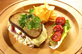 Reuben sandwich: cheese, corned beef and sauerkraut