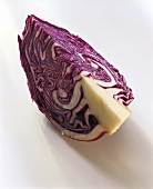 A quarter of a red cabbage on white background