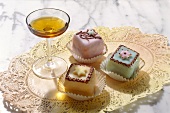A glass of Amaretto with petit four