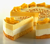 Cream cake with peaches, a piece cut