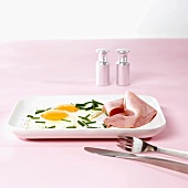 Two fried eggs with cooked ham