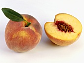 One half and one whole peach