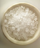 Sea salt crystals in a white dish