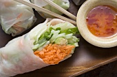 Vietnamese rice paper rolls with vegetables and spicy dip