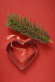 Heart-shaped biscuit cutters and fir sprig