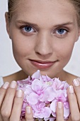 Young woman with hydrangea flower