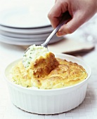 Cheese soufflé with spoon