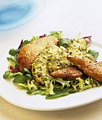 Chicken on salad leaves