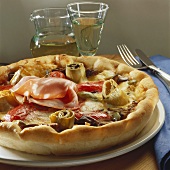 Pizza topped with artichokes and mortadella