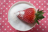 Strawberry in a bowl of sugar