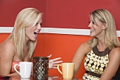 Two blond girls in café