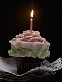 A cupcake with a candle