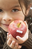 Girl with an organic apple